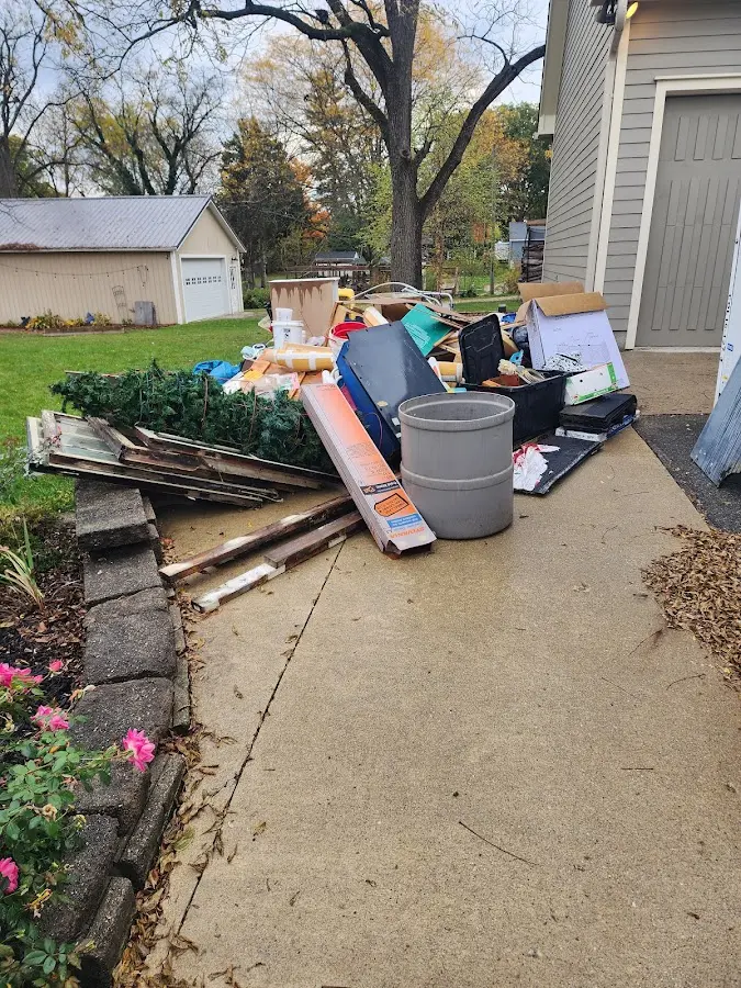 Dumpster being loaded with debris for Residential Dumpster Rental in Granite Falls